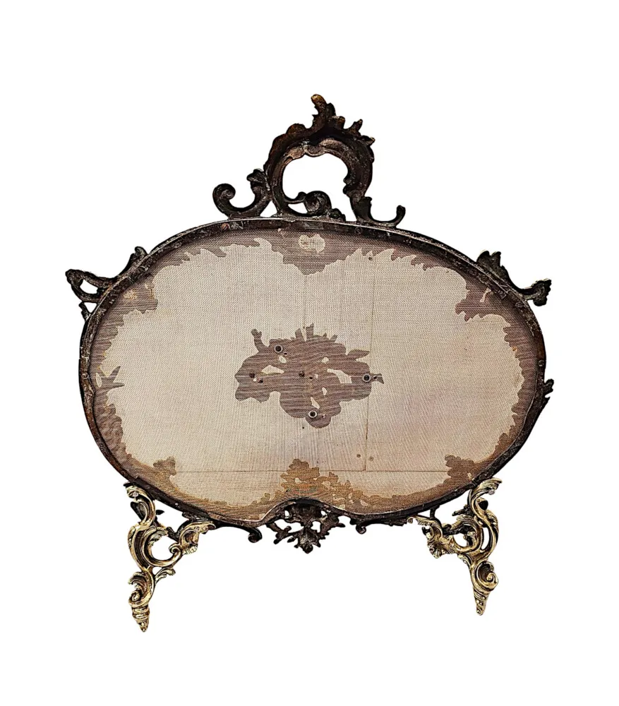 A Gorgeous 19th Century Polished  Brass Fire Screen in the Rococco Design with Cherub Detail