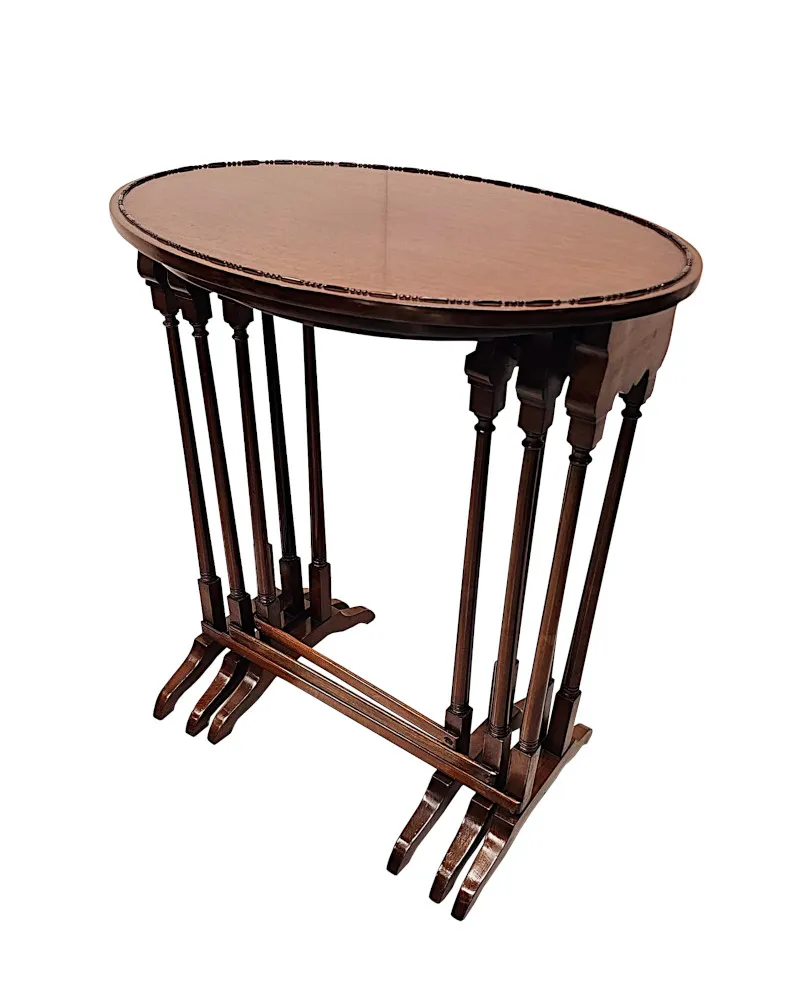 A Very Fine Edwardian Nest of Three Oval Tables