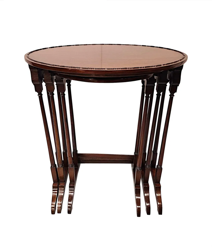 A Very Fine Edwardian Nest of Three Oval Tables
