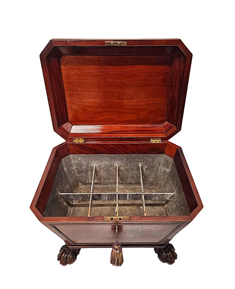 A Very Fine Early 19th Century Irish Sarcophagus Shaped Cellarette or Wine Cooler on Paw Foot