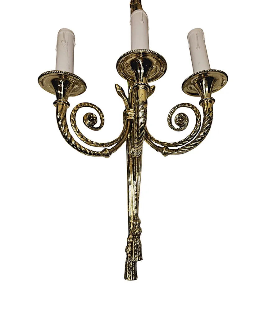 A Fabulous Set of Four Early 20th Century Three Branch Brass Wall Lights