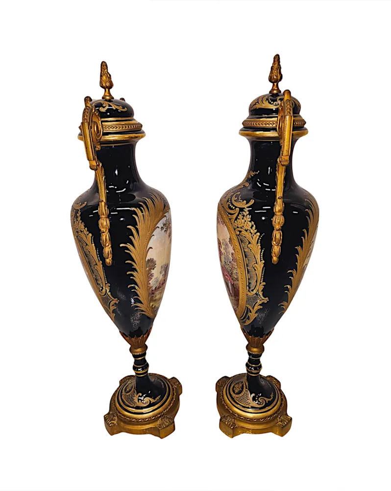 A Very Rare Pair of 19th Century French Hand Painted Sevres Style Urns with Ormolu Mounts