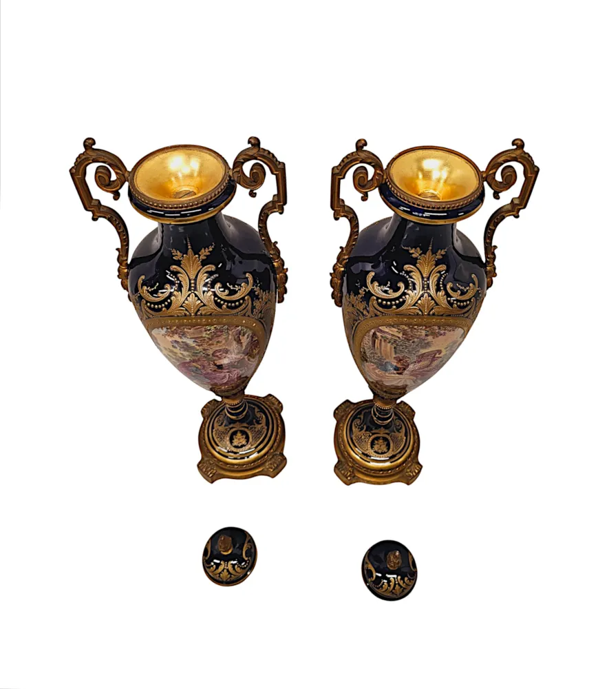 A Very Rare Pair of 19th Century French Hand Painted Sevres Style Urns with Ormolu Mounts