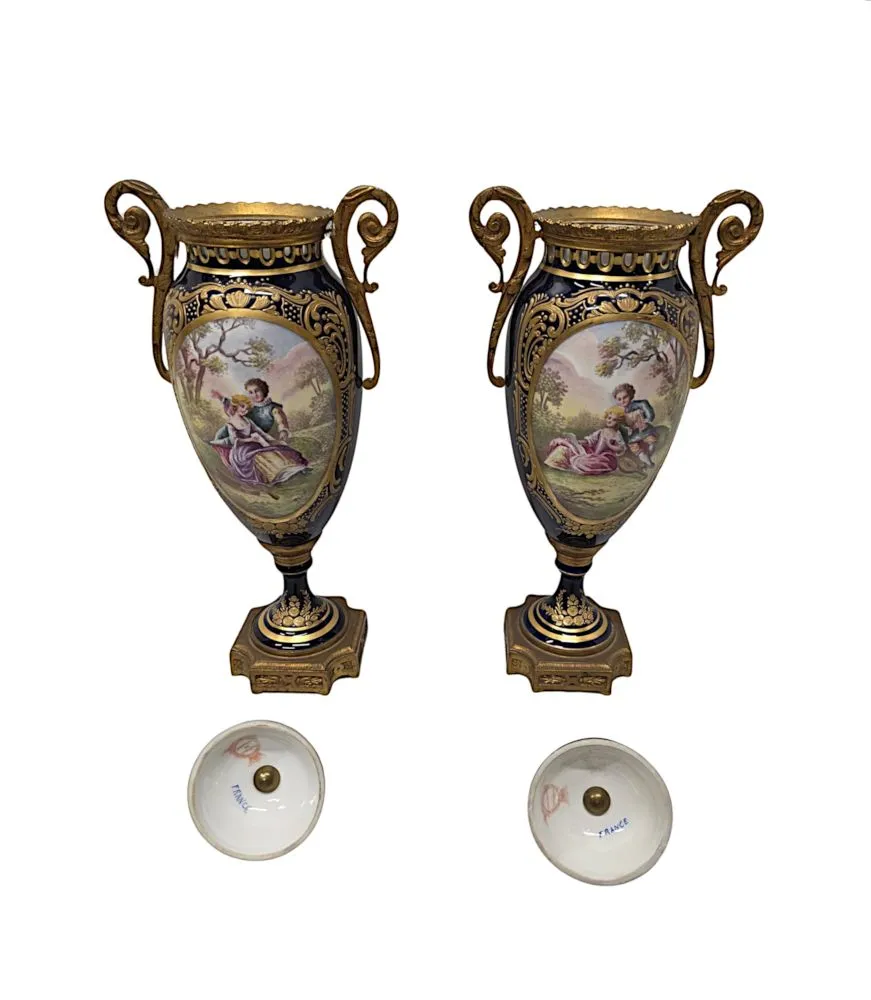  A Very Fine Pair of 19th Century Hand Painted Sevres Style Lidded Urns