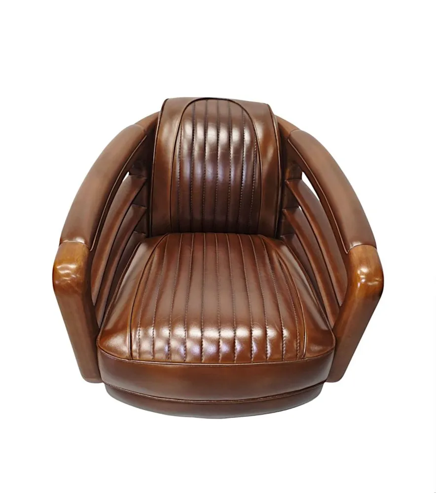 A Fabulous Handmade Walnut and Chrome Revolving Leather Armchair