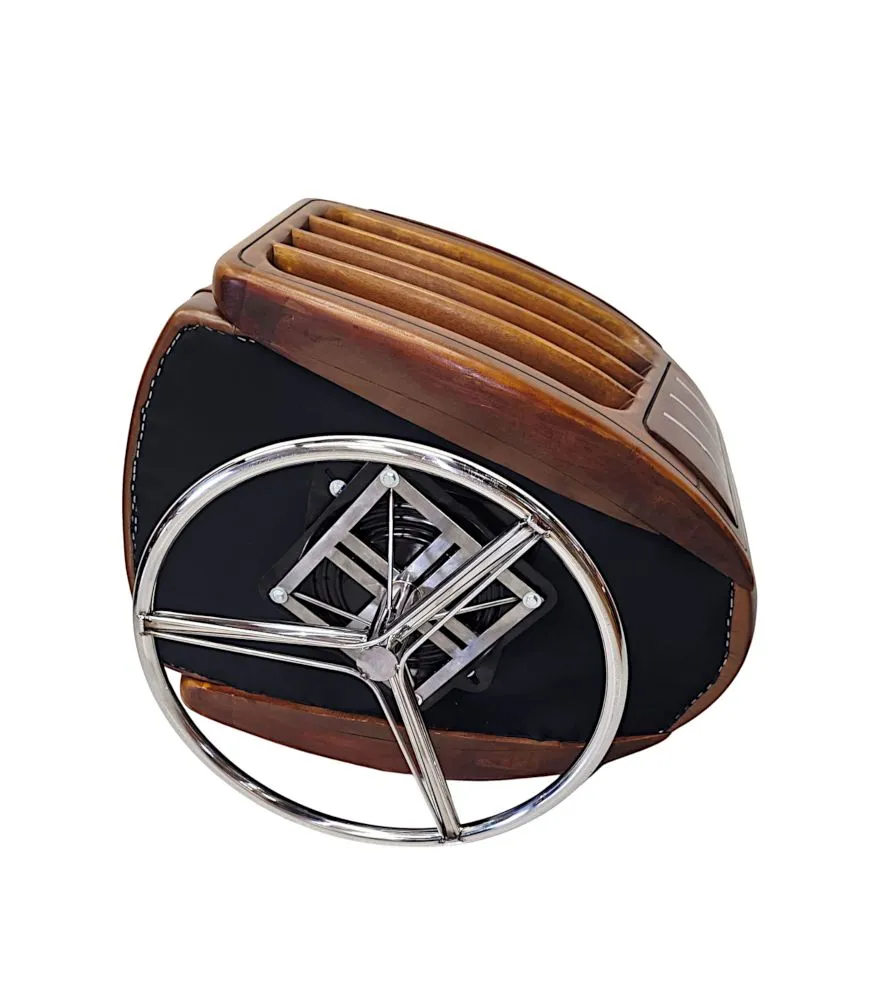 A Fabulous Handmade Walnut and Chrome Revolving Leather Armchair