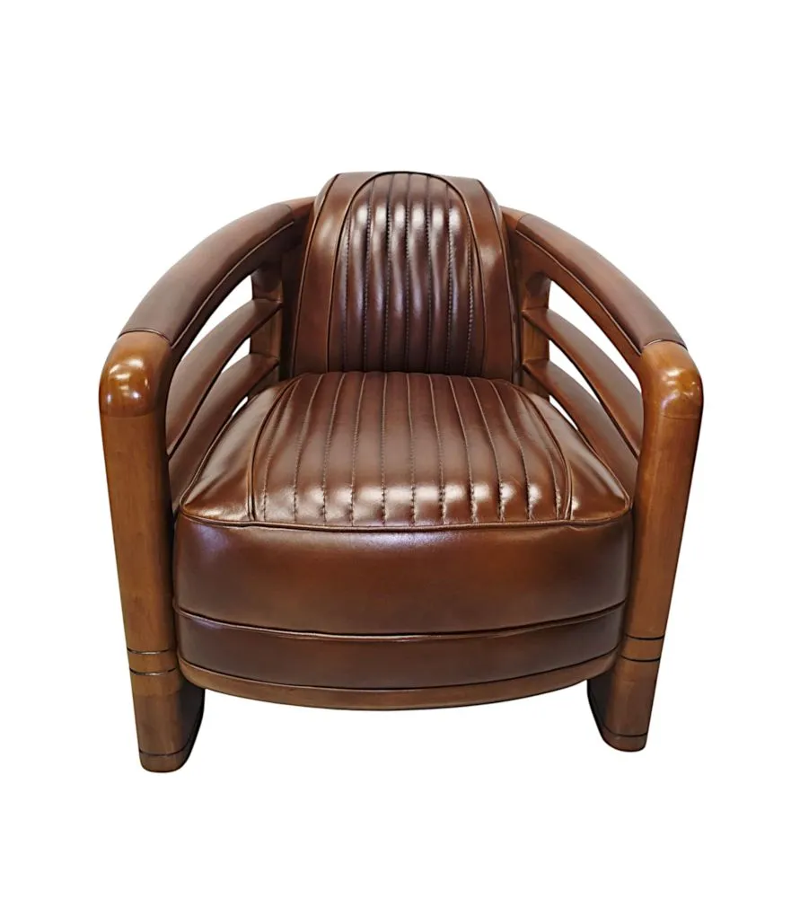 A Very Fine Art Deco Design Walnut and Leather Club Armchair