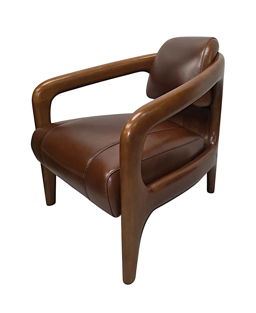 A Fabulous Mid Century Design Walnut and Leather Armchair
