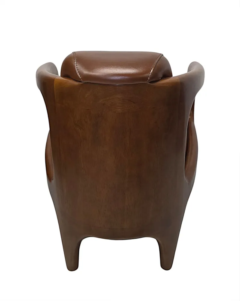 A Fabulous Mid Century Design Walnut and Leather Armchair