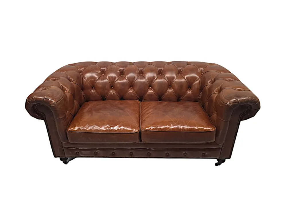 A Fabulous Leather Chesterfield Two Seater Couch in the Victorian Manner