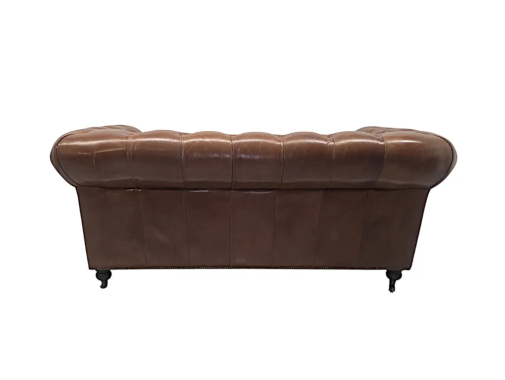 A Fabulous Leather Chesterfield Two Seater Couch in the Victorian Manner